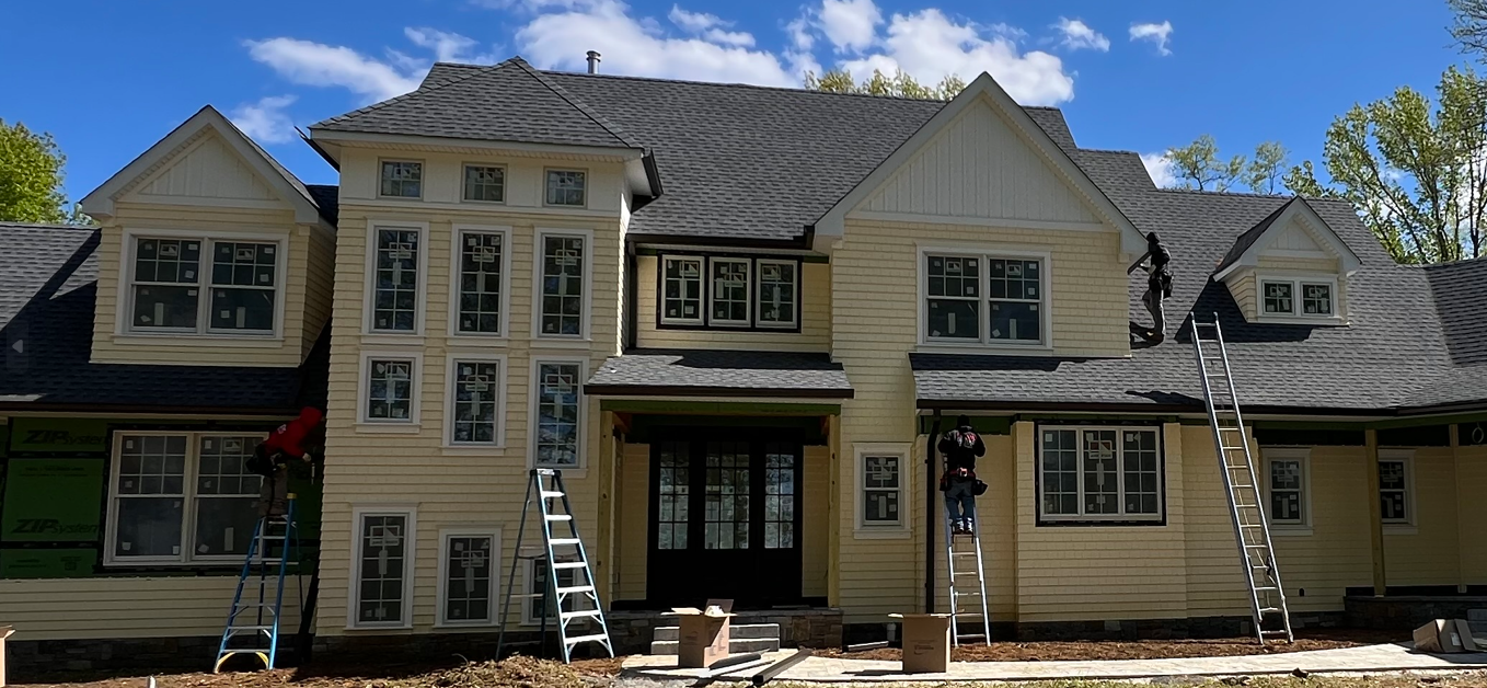 Modern home with new copper seamless gutters at sunset